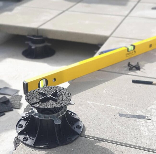 adjustable plastic pedestal support holding outdoor patio pa